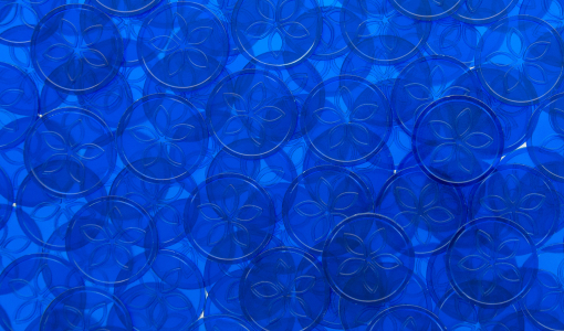 Transparent blue Tokens in Stock embossed with flower